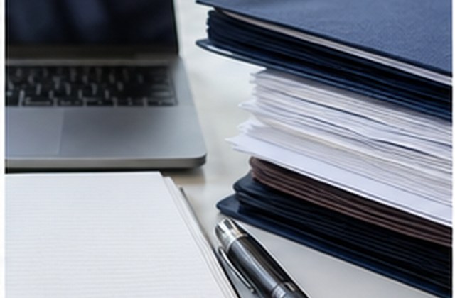 Organized administrative documents and laptop